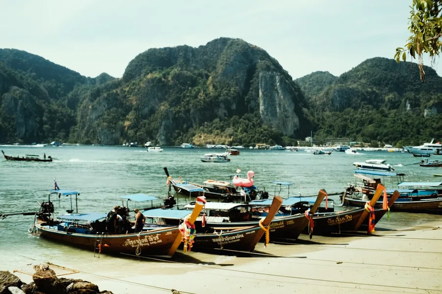Phi Phi Islands ferry pier crowd and boats Thailand Phuket Thailand