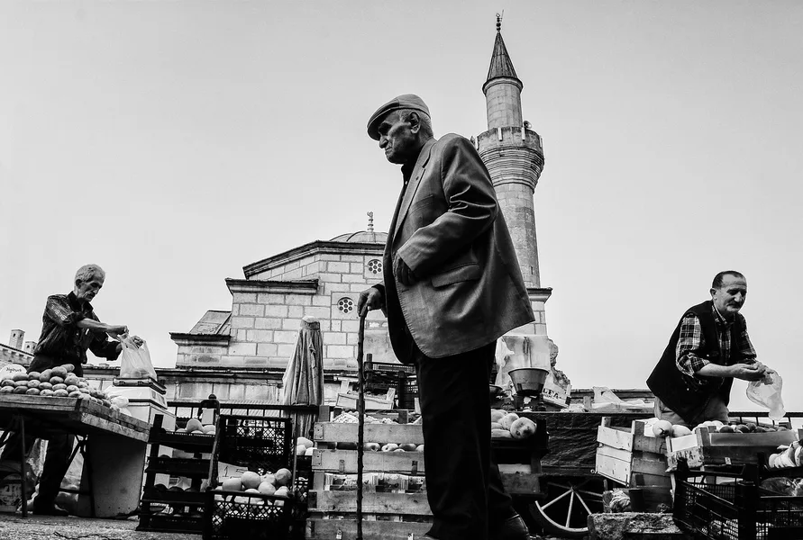 elderly couple eating street food at Antalya bazaar Turkey 2025