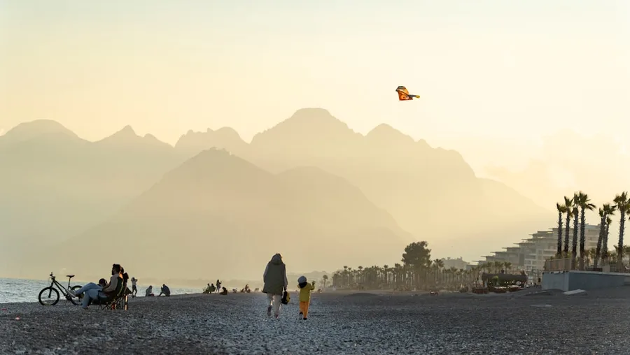 family with dog on Antalya beach Turkey budget travel