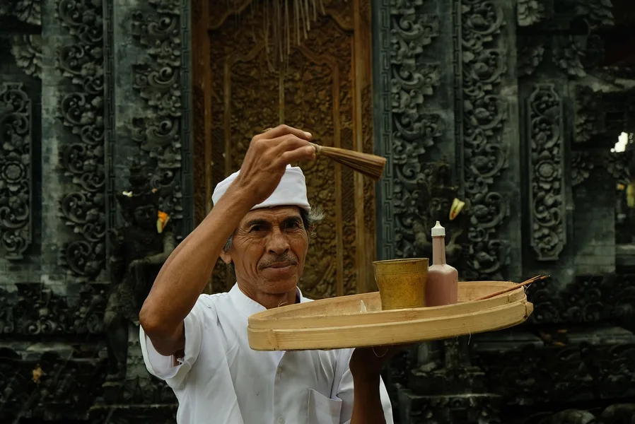 Bali temple visitors wearing sarong and sash Indonesia Osh Kyrgyzstan