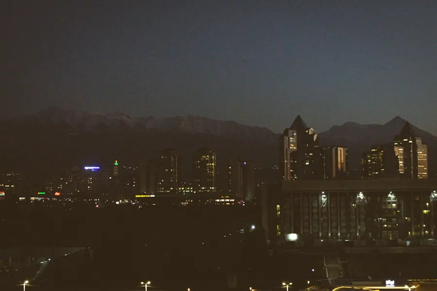 night view of Almaty city with mountains background