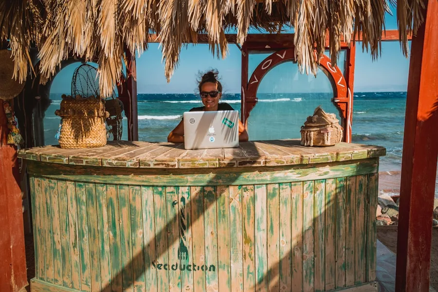 digital nomad paying with Egyptian pounds at street cafe Sharm el Sheikh Egypt Kotor Montenegro