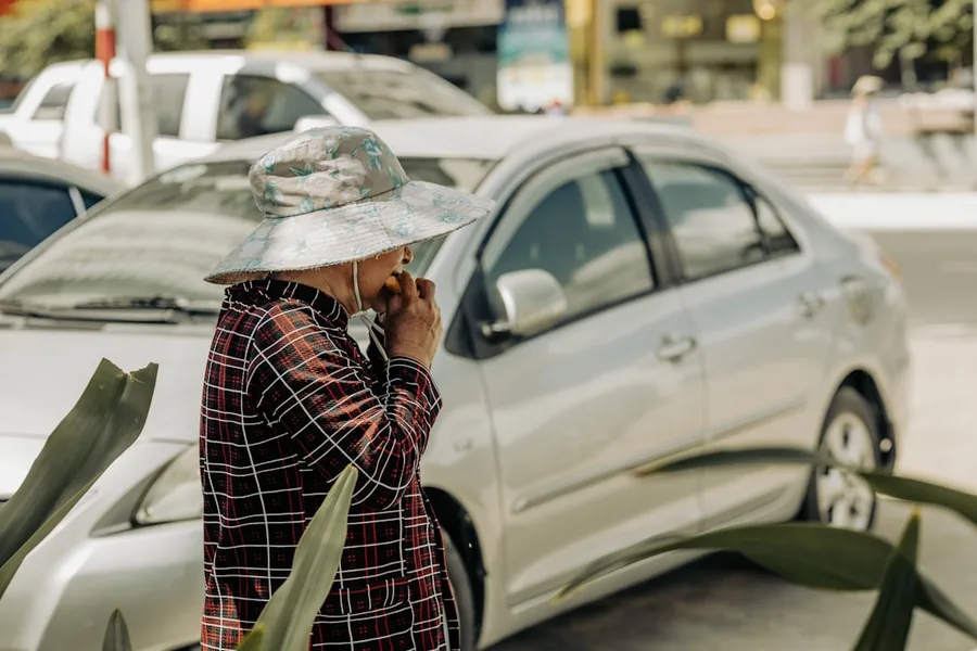 pensioner shows savings on mobile communication in Nha Trang Vietnam low cost