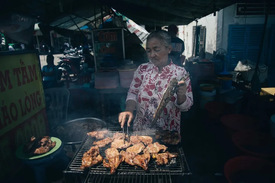 woman solo traveler eating street food Phuket
