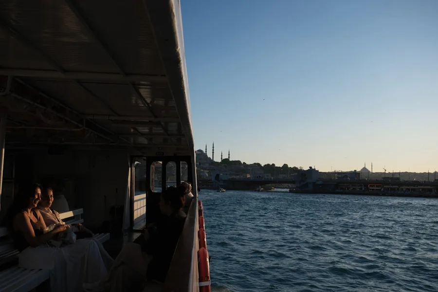 couple enjoying sunset ferry Bosphorus Istanbul budget romance