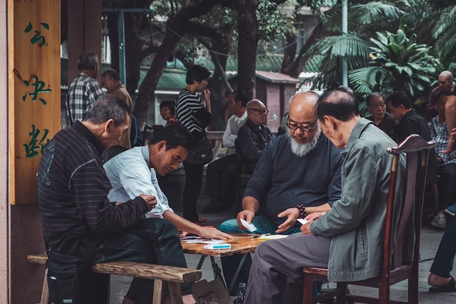 family with baby paying cash on Guangzhou bus China budget