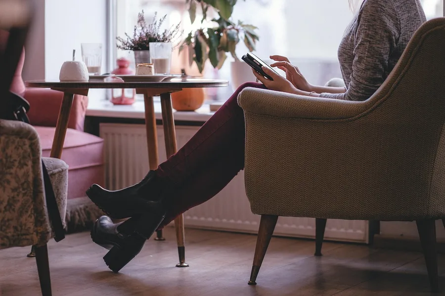 introvert solo woman reading in cozy cafe Kolomna Saint Petersburg Kotor Montenegro