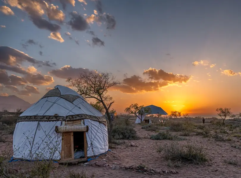 yurt camp on shore of Issyk-Kul early May morning mist