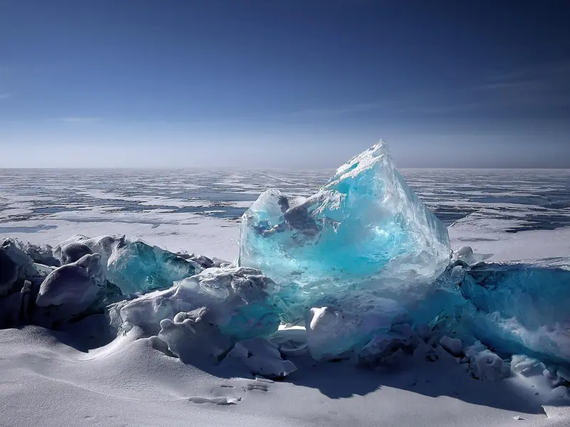 ferry crossing Olkhon gate strait Lake Baikal in spring with ice floes