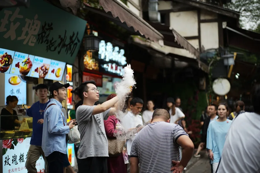 crowded evening food street steam smoke Sanya Hainan China