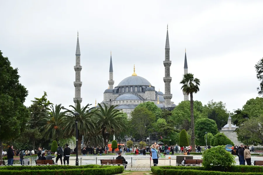 Family with children walking in Sultanahmet Square Istanbul Turkey
