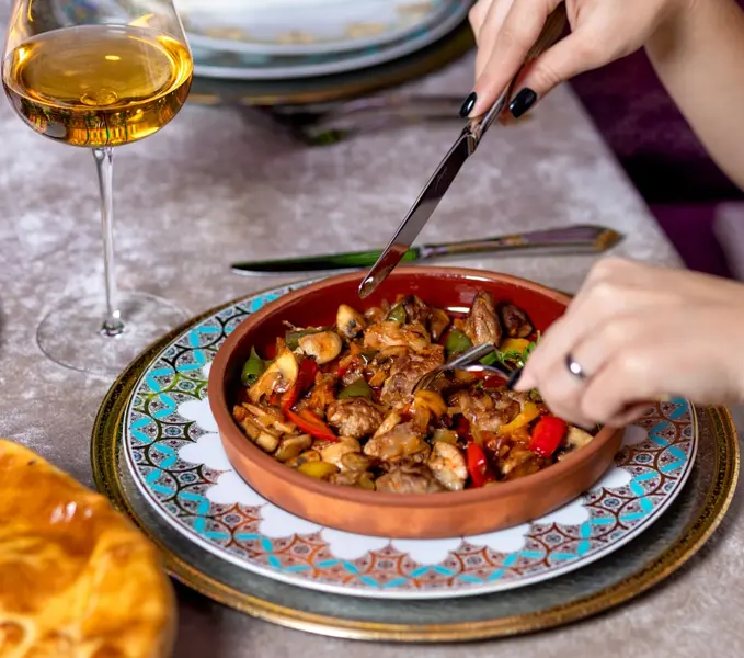traditional Kyrgyz kuurdak dish with meat and potatoes