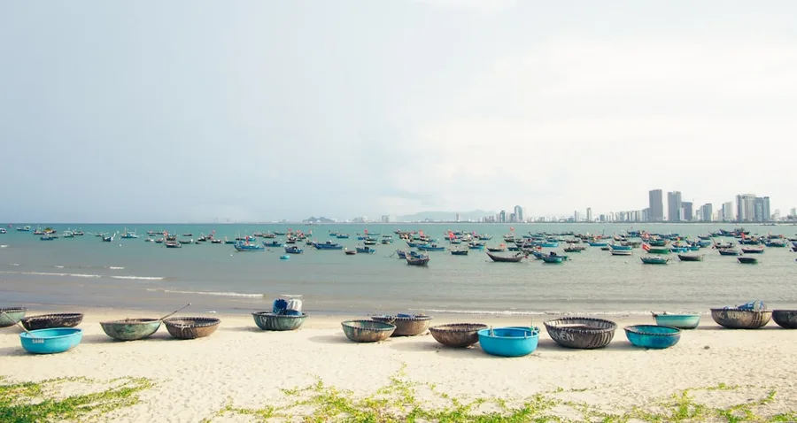 freelancer working on laptop Da Nang Vietnam beach