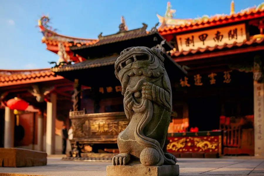 solo female traveler at Hainan temple wearing appropriate clothes China