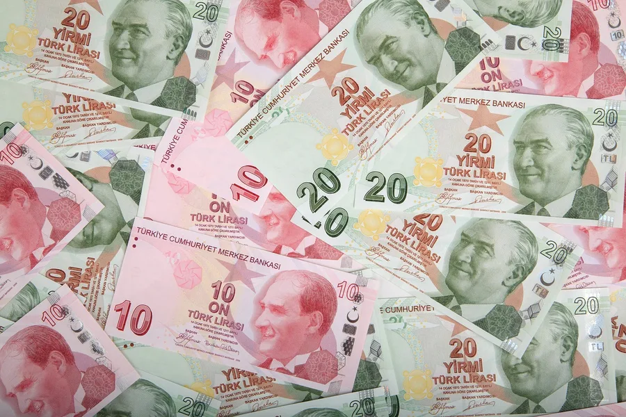 Turkish lira cash payment at Istanbul spice bazaar stall