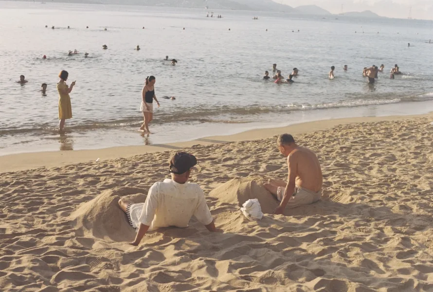 Nha Trang beach Vietnam family with child stroller walking
