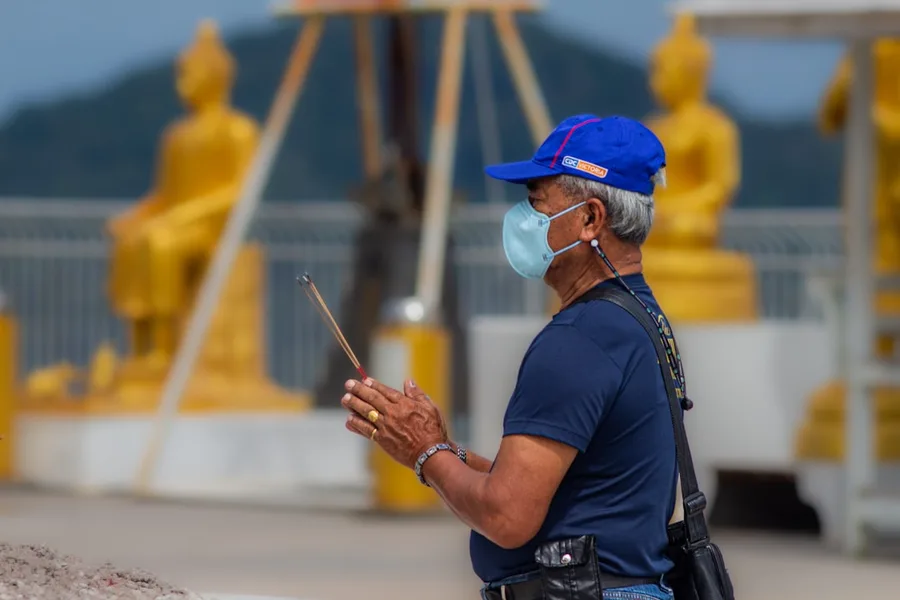 senior couple checking travel budget Phuket Thailand