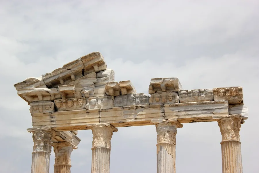 Tourist taking selfie at Temple of Apollo Side Turkey ancient ruins